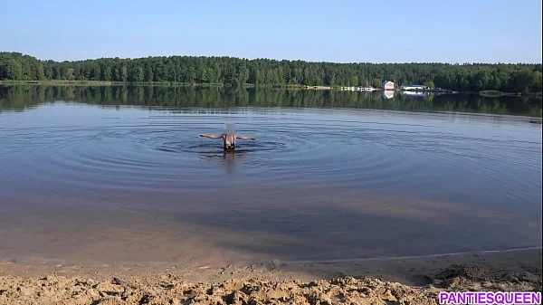 Naked girl goes skinny dipping in public beach